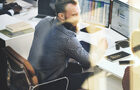 man sat at a desk